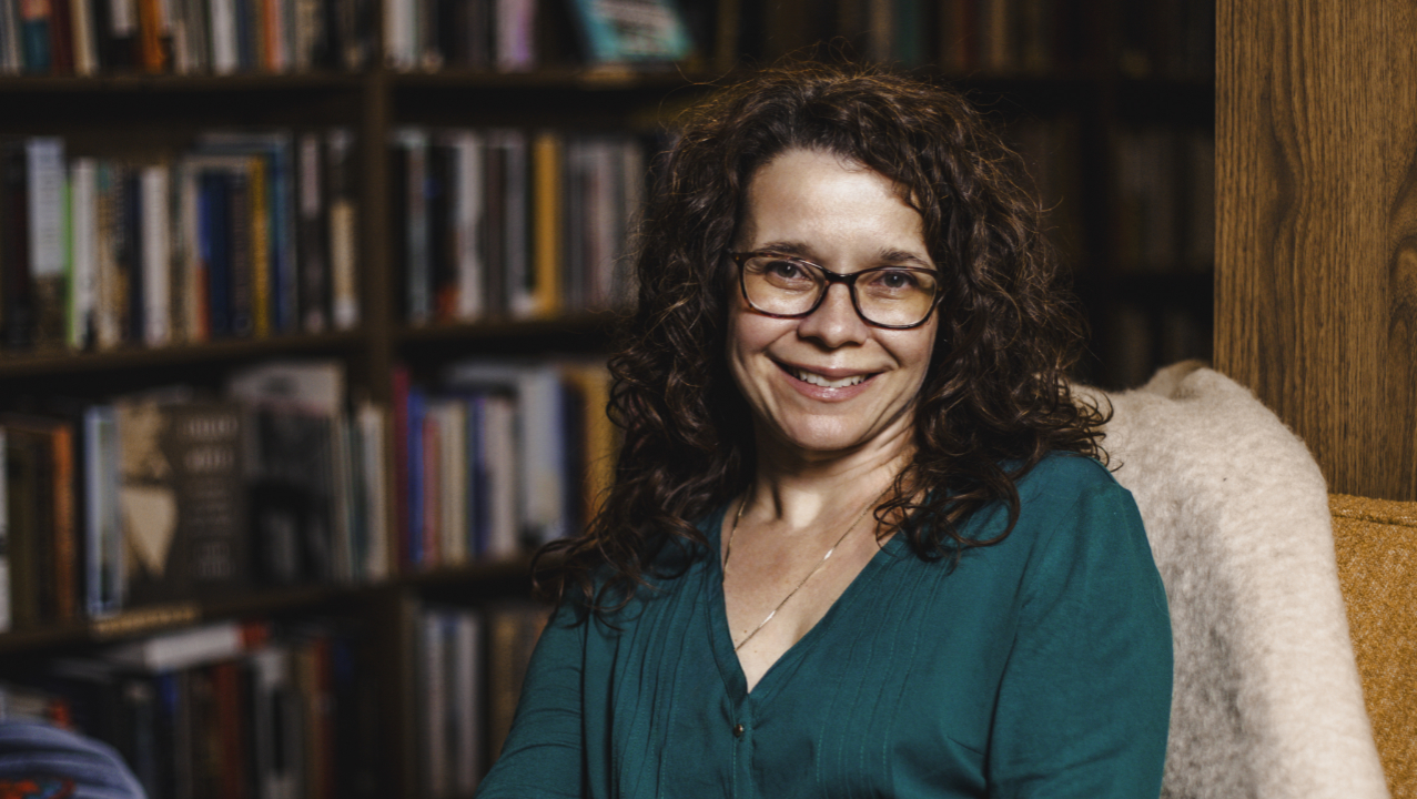 Rachel Landry Berdan seated on a couch